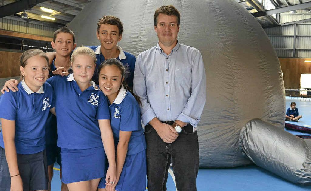 Year 7 West SS students Mitch Lyons, Brendan Hoffman, (front)Jacqui Richmond-Clay, Bella Mountain and Kirsten Hammermeister helped teacher Alyn Roberts set up the Star Lab for their space night last night and tonight.
